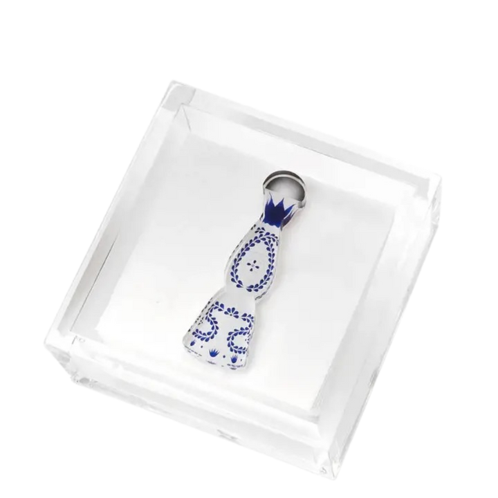 acrylic cocktail napkin holder featuring a porcelain carafe of alcohol