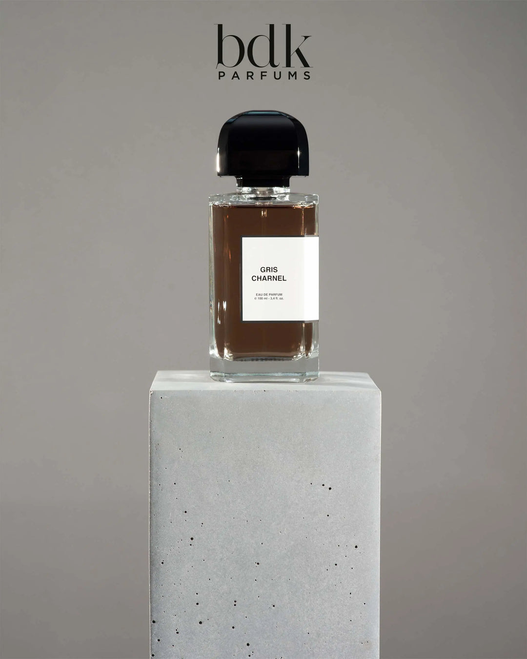BDK Parfums Eau de Parfum bottle displayed on a stone pedestal — niche Parisian fragrance collection at Mood by DMJ