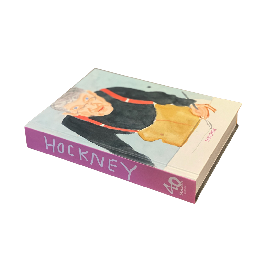 A book cover featuring an illustration of David Hockney with a dog, indicating the artist's work and life. Spine showing