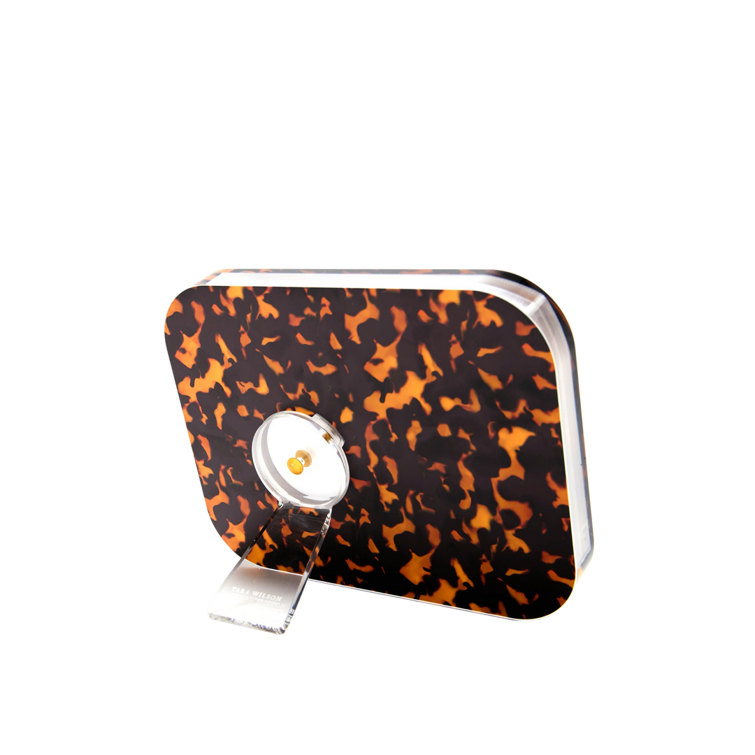 Tortoise acrylic POP Frame with thick clear body and twist-out kickstand.