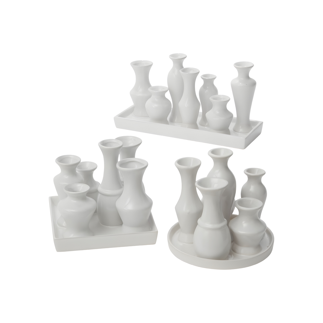 White ceramic budvase centerpiece featuring modern tulip-shaped vases on a tray