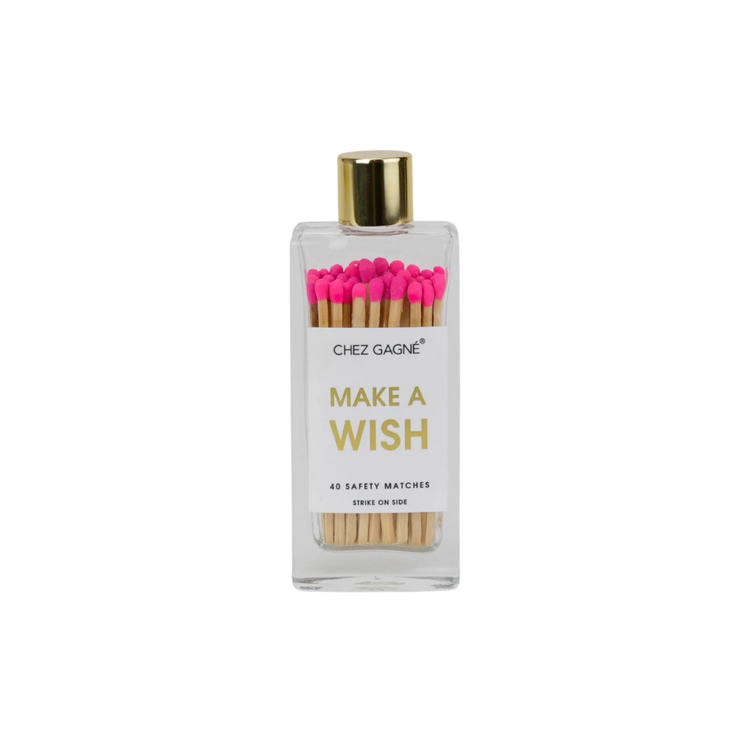 Glass bottle safety matches with pink tips and gold lid labeled Make A Wish displayed for candle lighting and celebrations