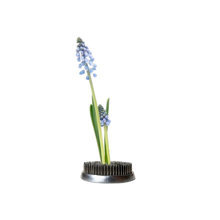 Kenzan metal floral frog for ikebana flower arranging displayed with Artichoke Ceramic Vase at Mood by DMJ in Lafayette, Louisiana.