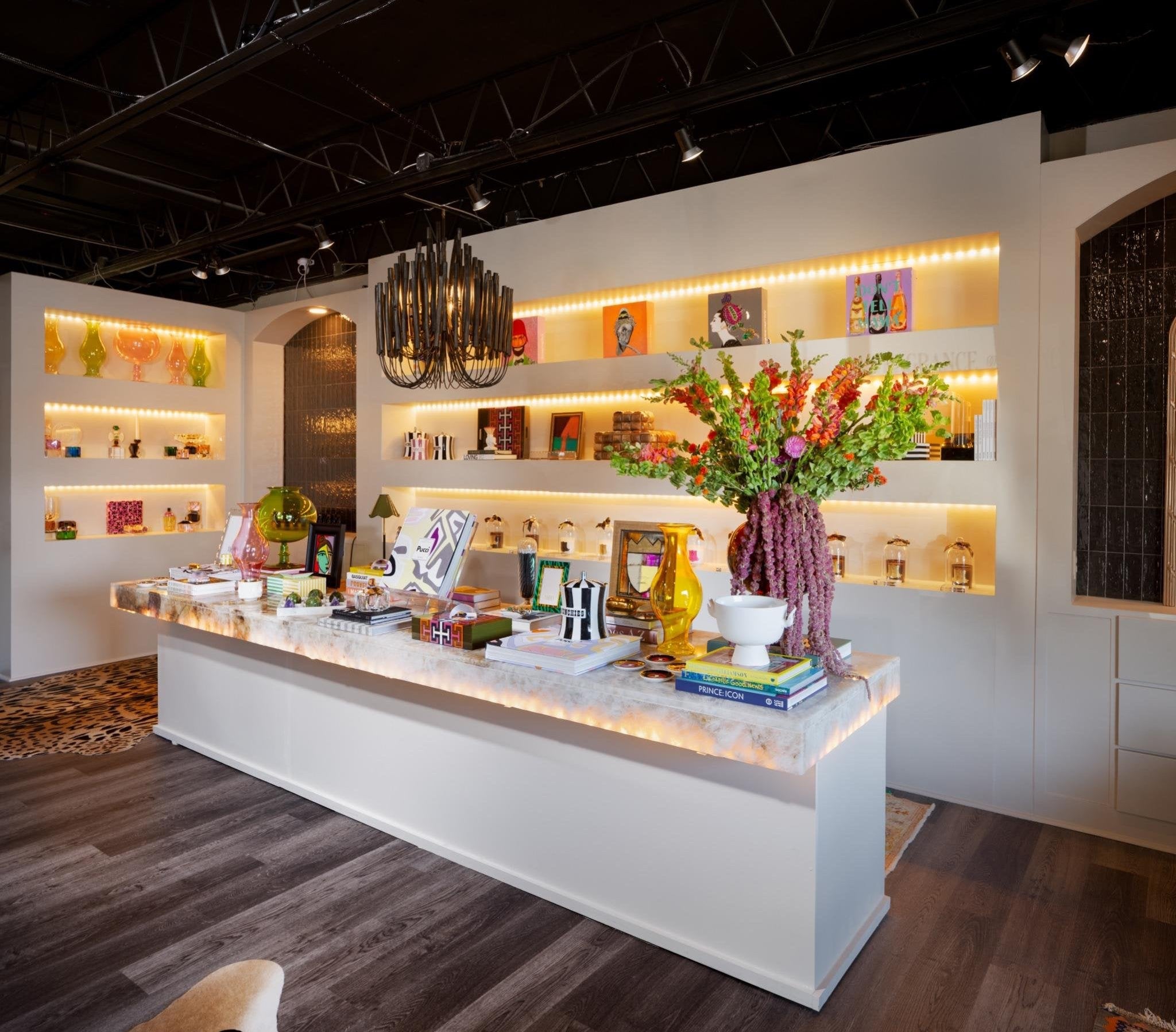 Modern interior design with a reception desk and decorative elements.