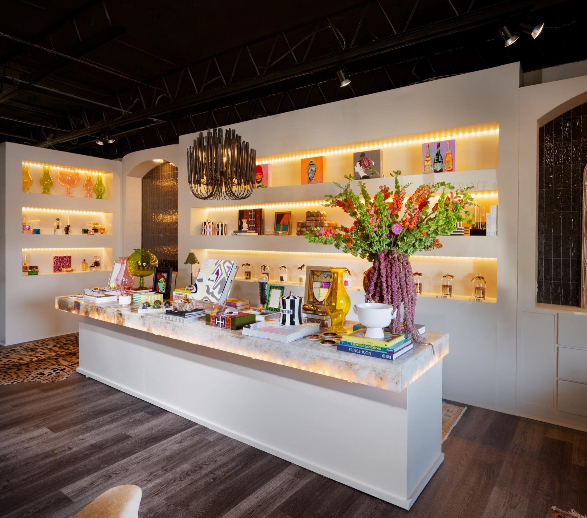 Modern interior design with a reception desk and decorative elements.