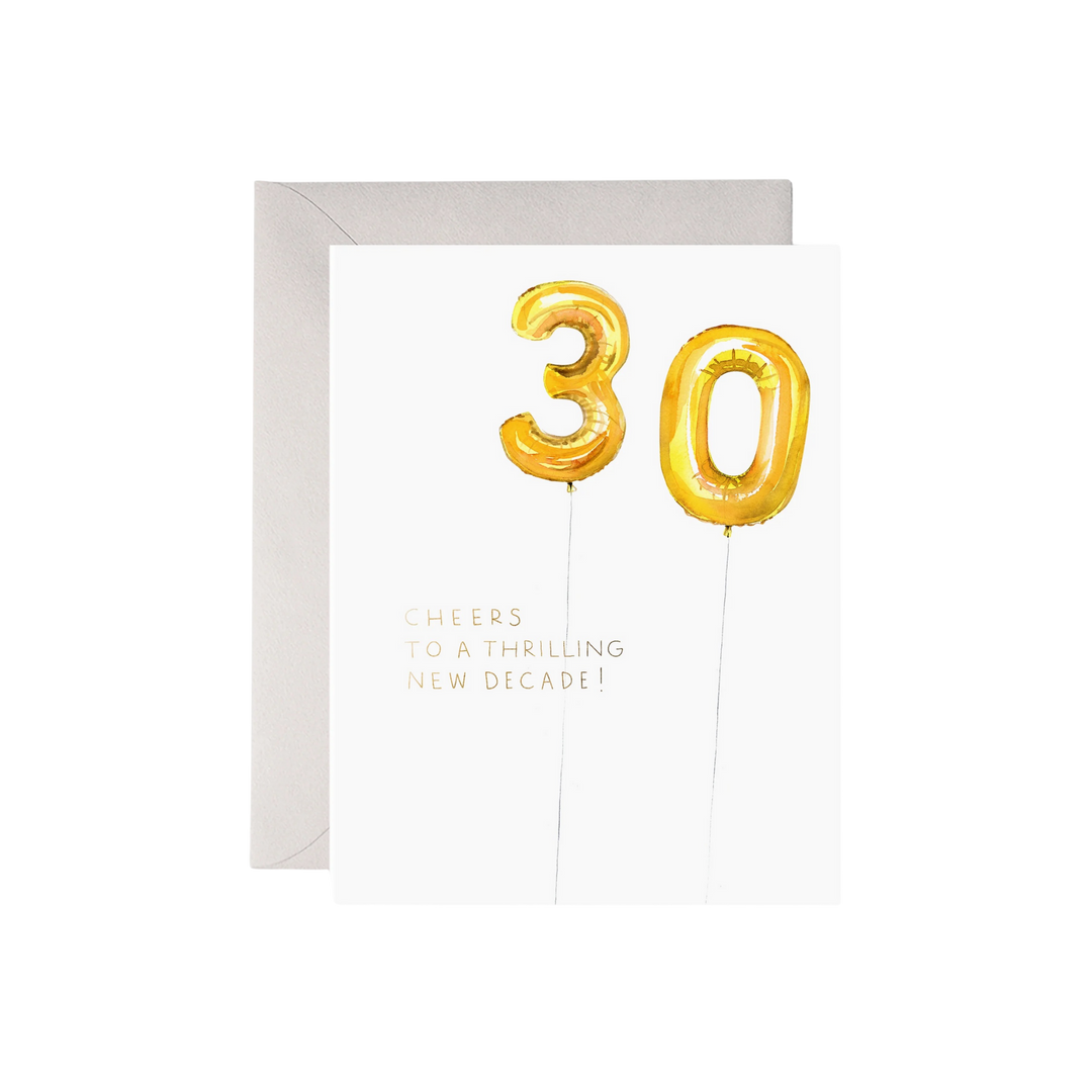 Greeting card with gold foil '30' balloons and text on a white background