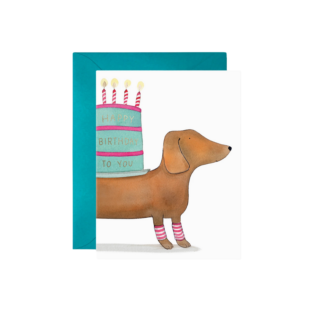 Birthday card with a dachshund and birthday cake illustration on a white background