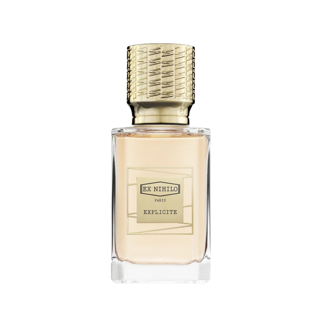 Perfume bottle with gold cap on a white background Ex Nihilo Explicite