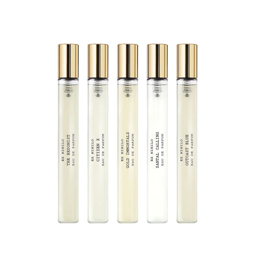 Set of five perfume bottles with gold caps on a white background Ex Nihilo Discovery set