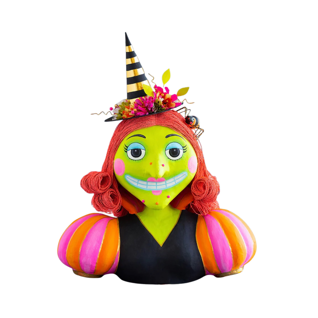 Colorful Halloween-themed figurine with a black and yellow striped hat and orange and pink striped arms on a white background. Glitterville at Mood by DMJ in Lafayette, LA.