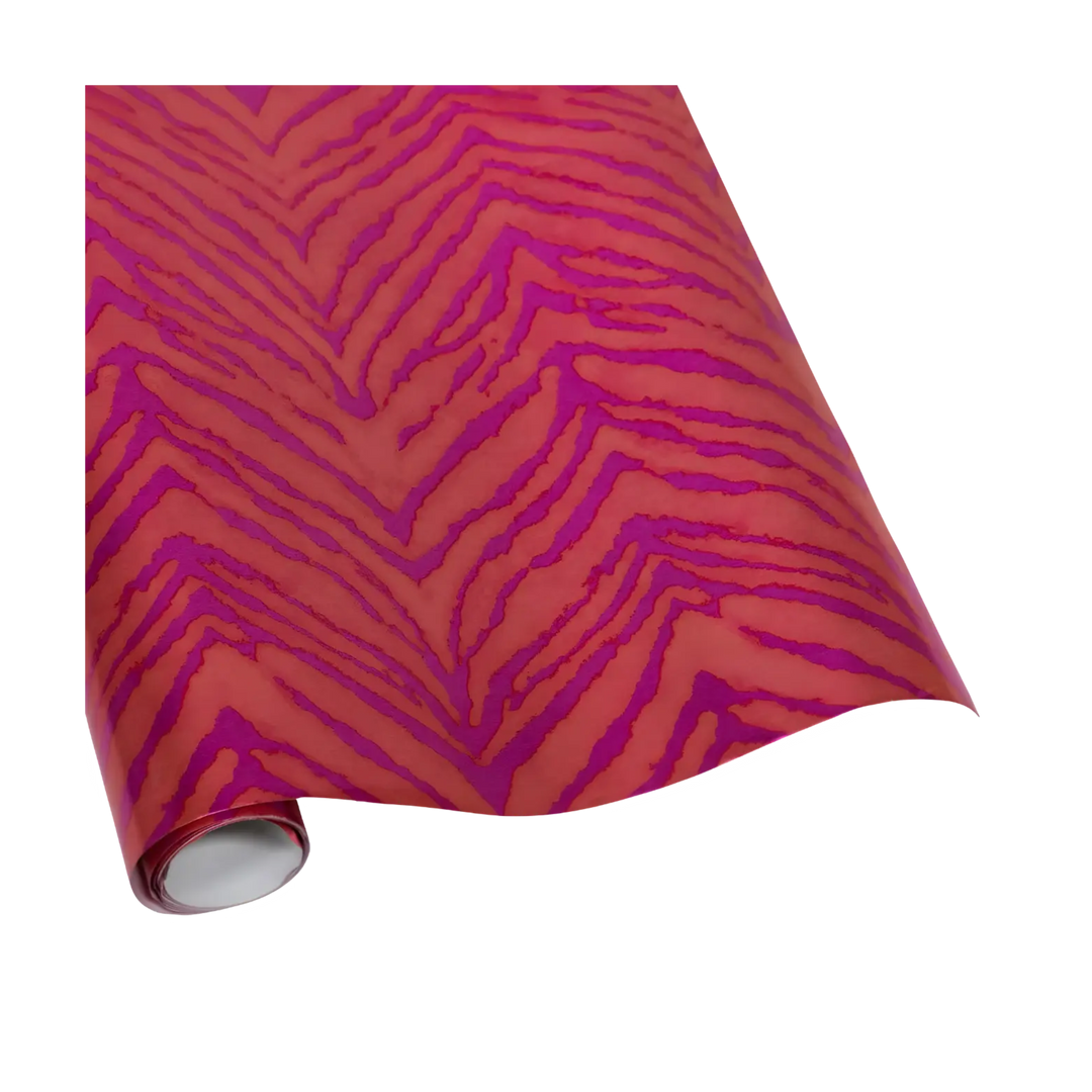 Hot pink and orange wrapping paper roll with a zebra-inspired foil design