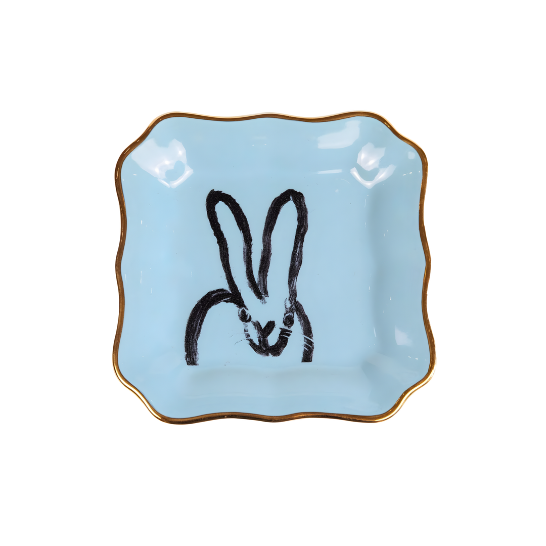 Hunt Slonem light blue bunny portrait porcelain plate with gold rim styled as decorative tabletop accent