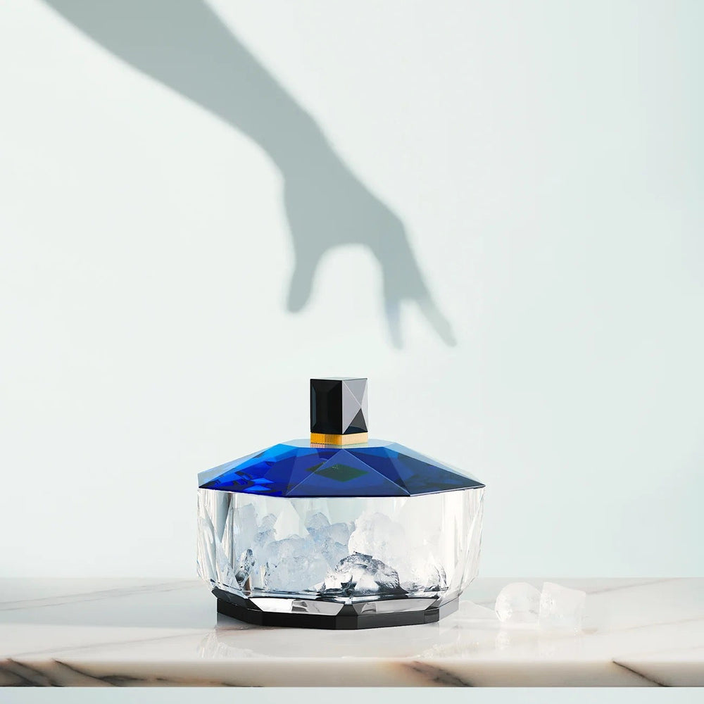 Reflections Copenhagen Grand New Haven Basin from Mood by DMJ — hand-cut crystal centerpiece in clear, light blue, grey, and bright yellow hues.