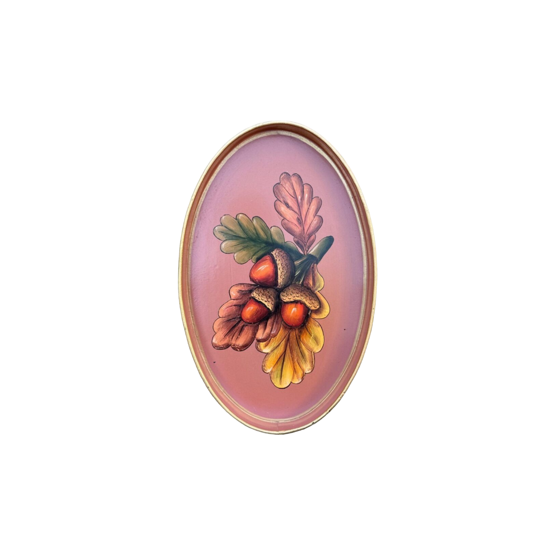 Oval pink iron tray with hand-painted acorns and oak leaves by Les Ottomans, available at Mood by DMJ.