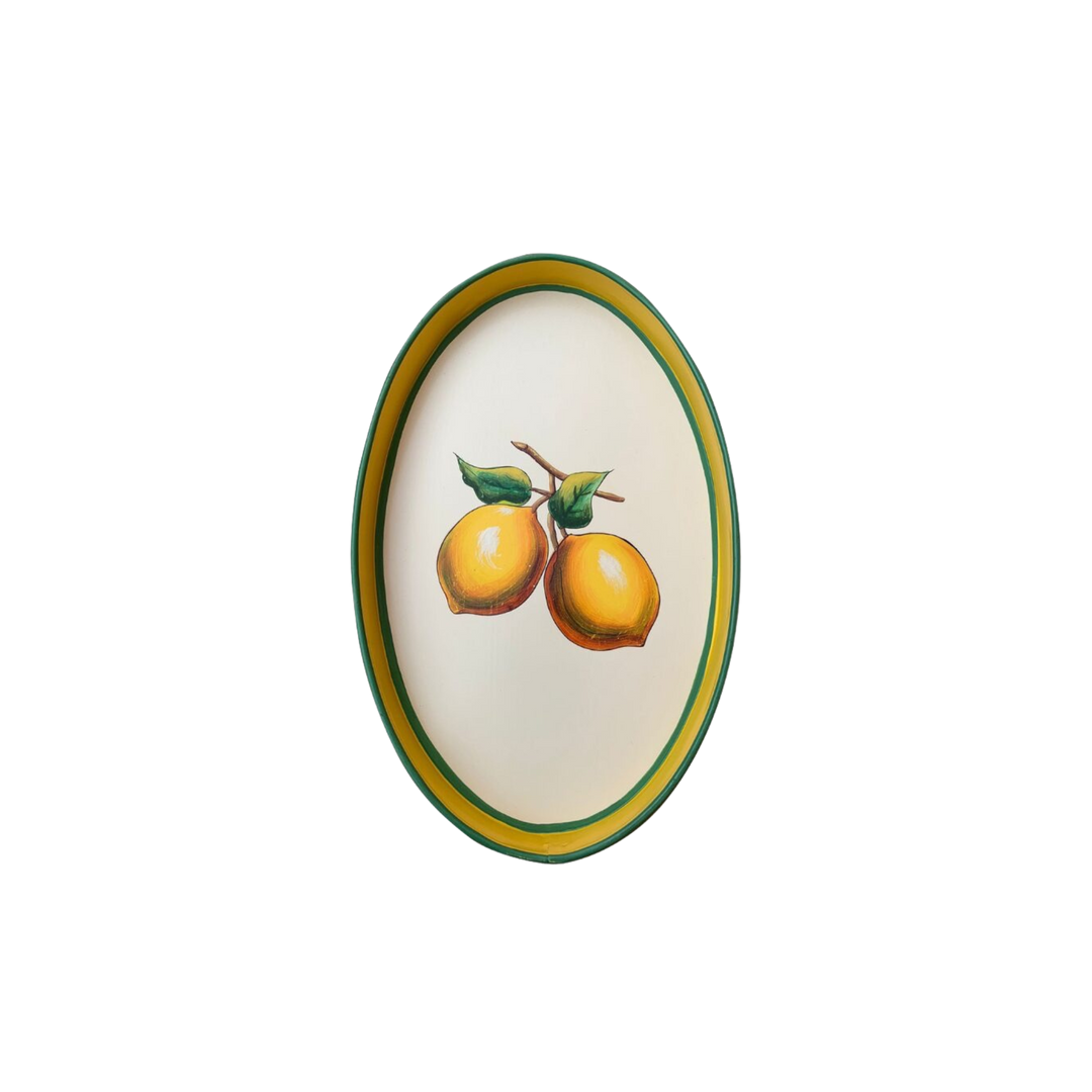 Oval hand-painted lemon iron tray by Les Ottomans in yellow and green accents, sold at Mood by DMJ.