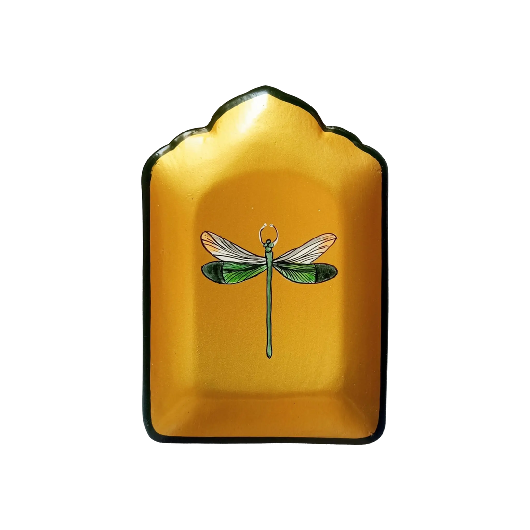 Small golden iron dish with hand-painted green and orange dragonfly by Les Ottomans, sold at Mood by DMJ.
