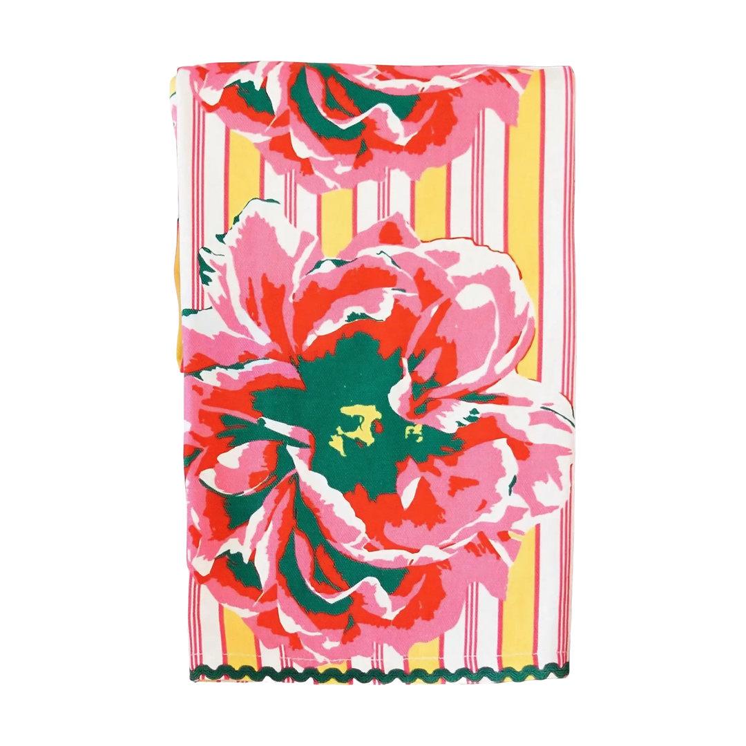 Joya Kitchen Towel with bold pink and coral floral design on striped background with decorative trim 