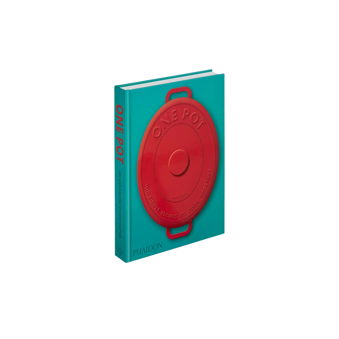 Book with a red pot lid on a turquoise background