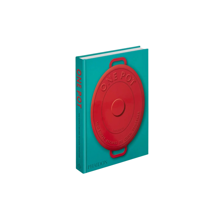 Book with a red pot lid on a turquoise background