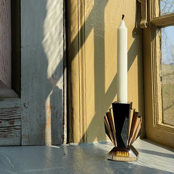 Brooklyn Candle Holder by Reflections Copenhagen featuring hand-cut crystal in black, brown, and rose tones inspired by New York’s Art Deco skyline – Mood by DMJ Lafayette, LA.