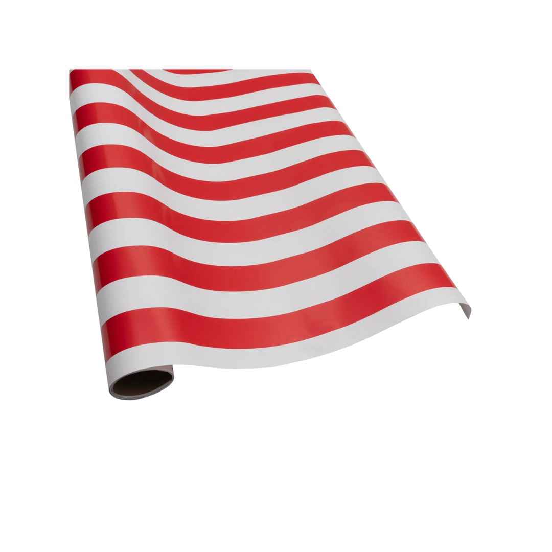 Red and white wrapping paper roll with a bold awning stripe pattern