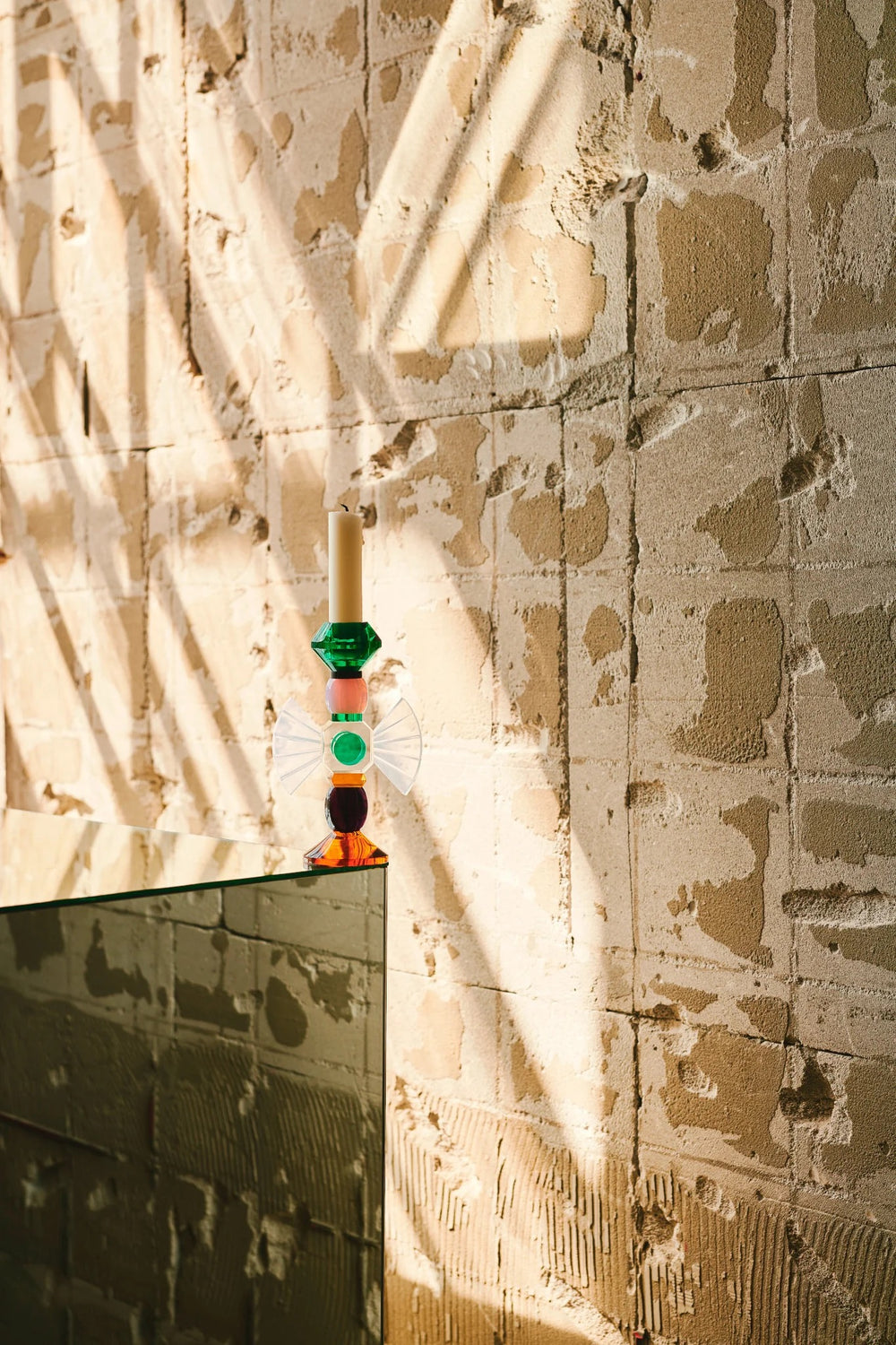 Carmina Candlestick Holder by Reflections Copenhagen featuring hand-cut crystal with opal wings, amber base, and emerald top – Mood by DMJ Lafayette, LA.