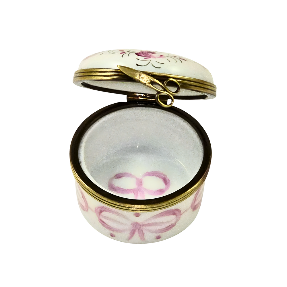 Open Pink Baby’s First Curl Limoges Box showing hand painted interior and gold hinge detail