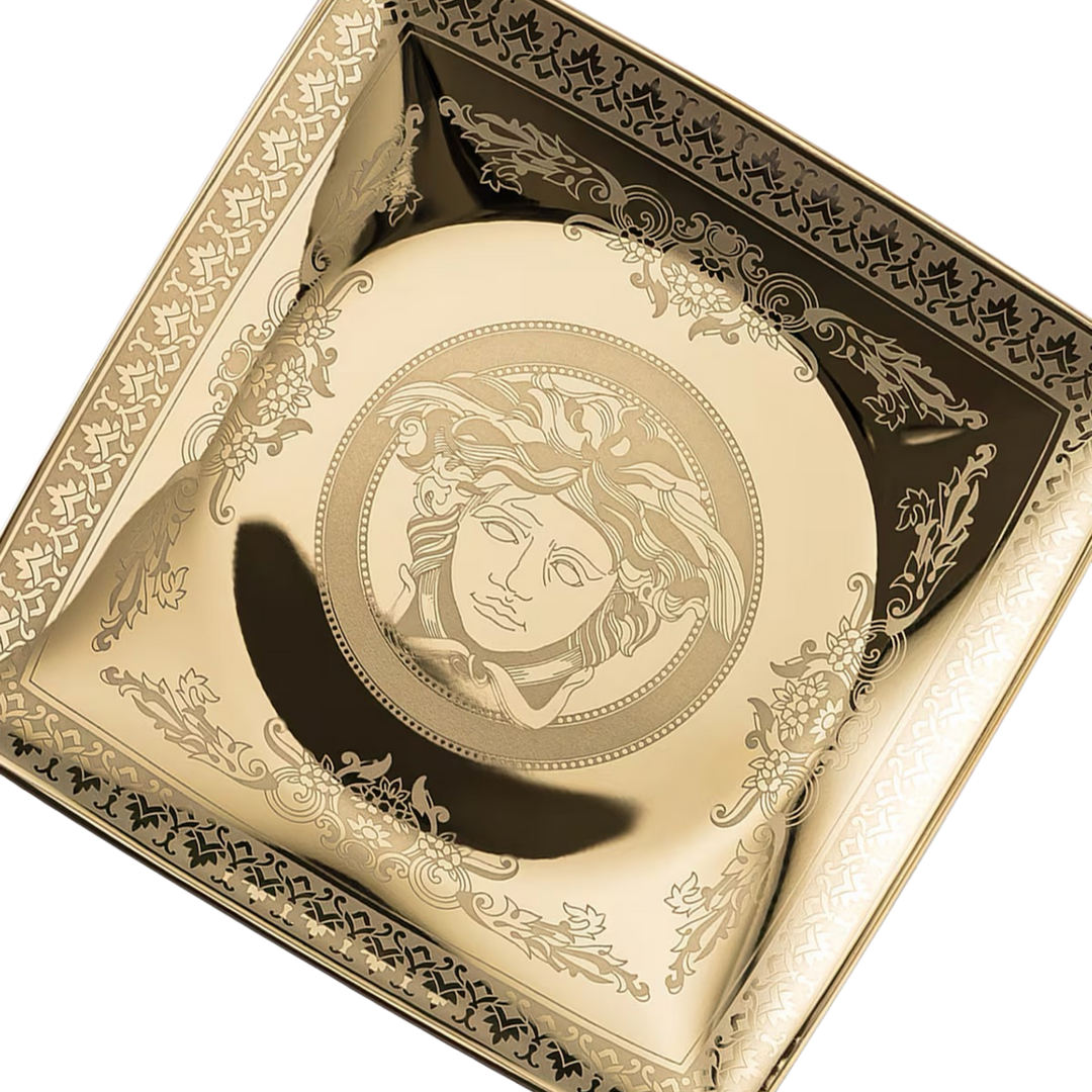 Close-up of the Versace Golden Medusa square dish by Rosenthal showing the gold Medusa head detail