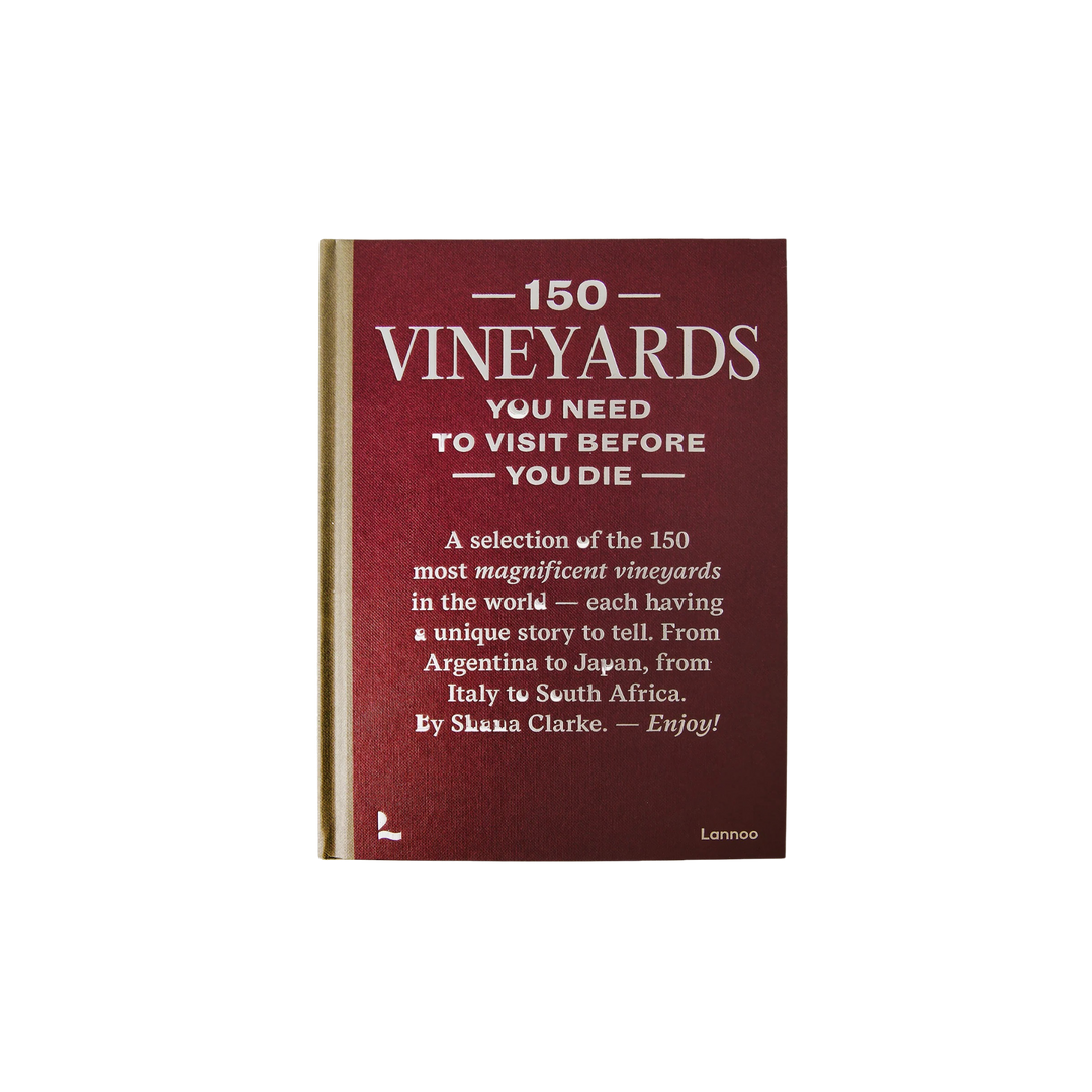 Coffee table book titled 150 Vineyards You Need to Visit Before You Die by Shana Clarke, featuring global vineyards, scenic wine regions, and luxury wine travel inspiration.