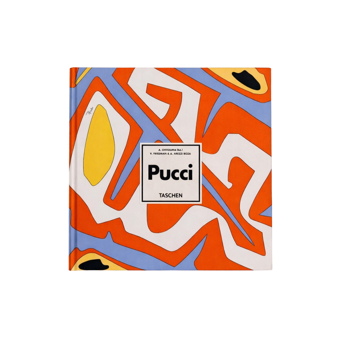 Taschen XL hardcover book Pucci featuring an orange, blue, white, and yellow abstract print cover, bound in original Emilio Pucci fabric.
