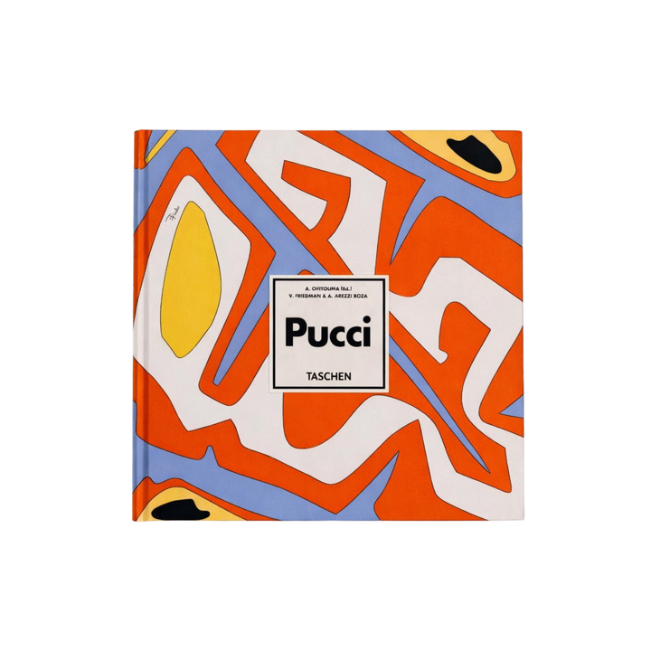 Taschen XL hardcover book Pucci featuring an orange, blue, white, and yellow abstract print cover, bound in original Emilio Pucci fabric.
