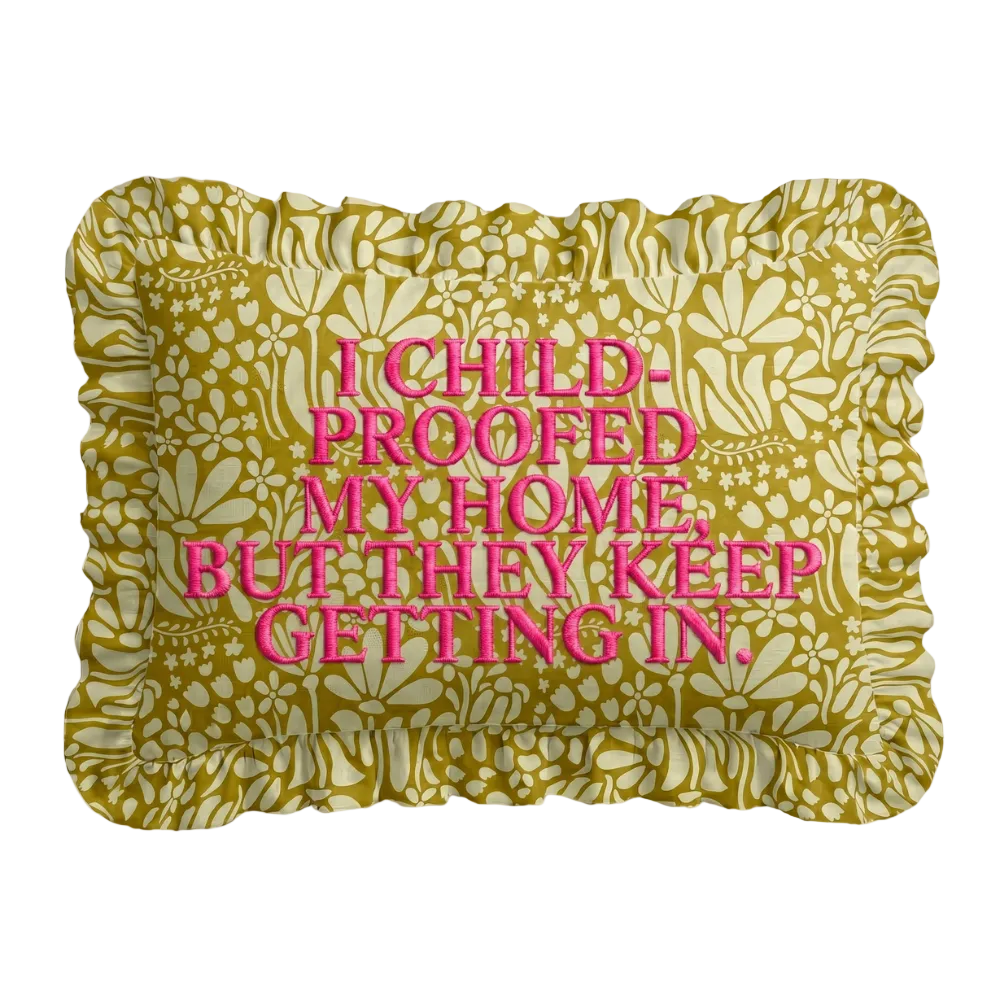 Chartreuse and cream botanical print lumbar pillow with a ruffled edge and I childproofed my home but they keep getting in hand-embroidered in pink
