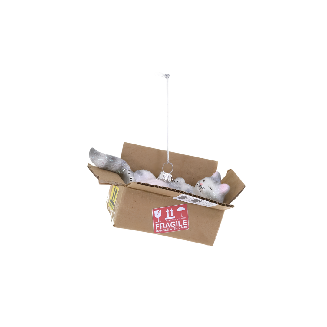 Best Cat Toy Ornament by Cody Foster, cody Foster gray and white glass cat Christmas ornament napping in a cardboard-style shipping box