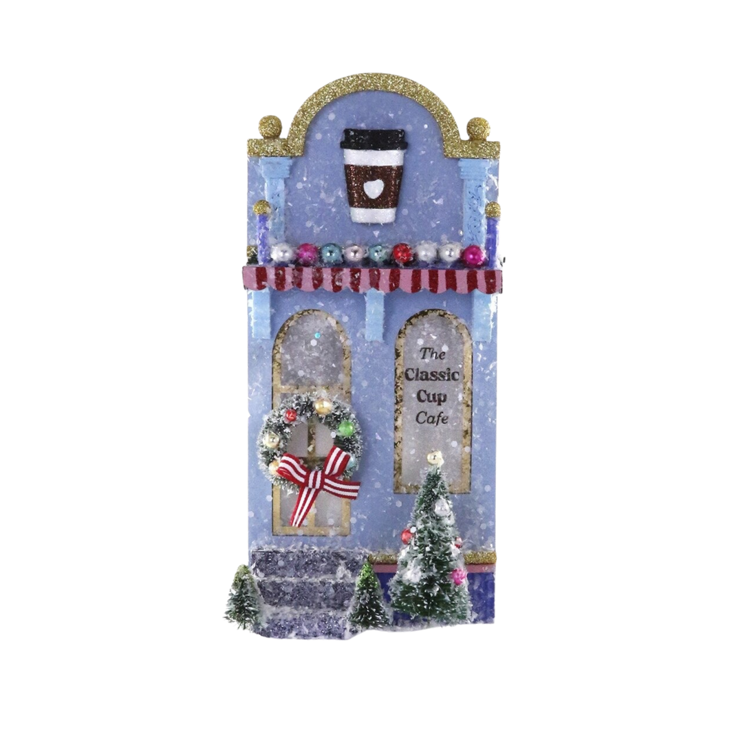 Cody Foster Coffee Shop Christmas village house, glittered blue cafe with coffee cup arch, striped awning, wreath, and bottle brush trees