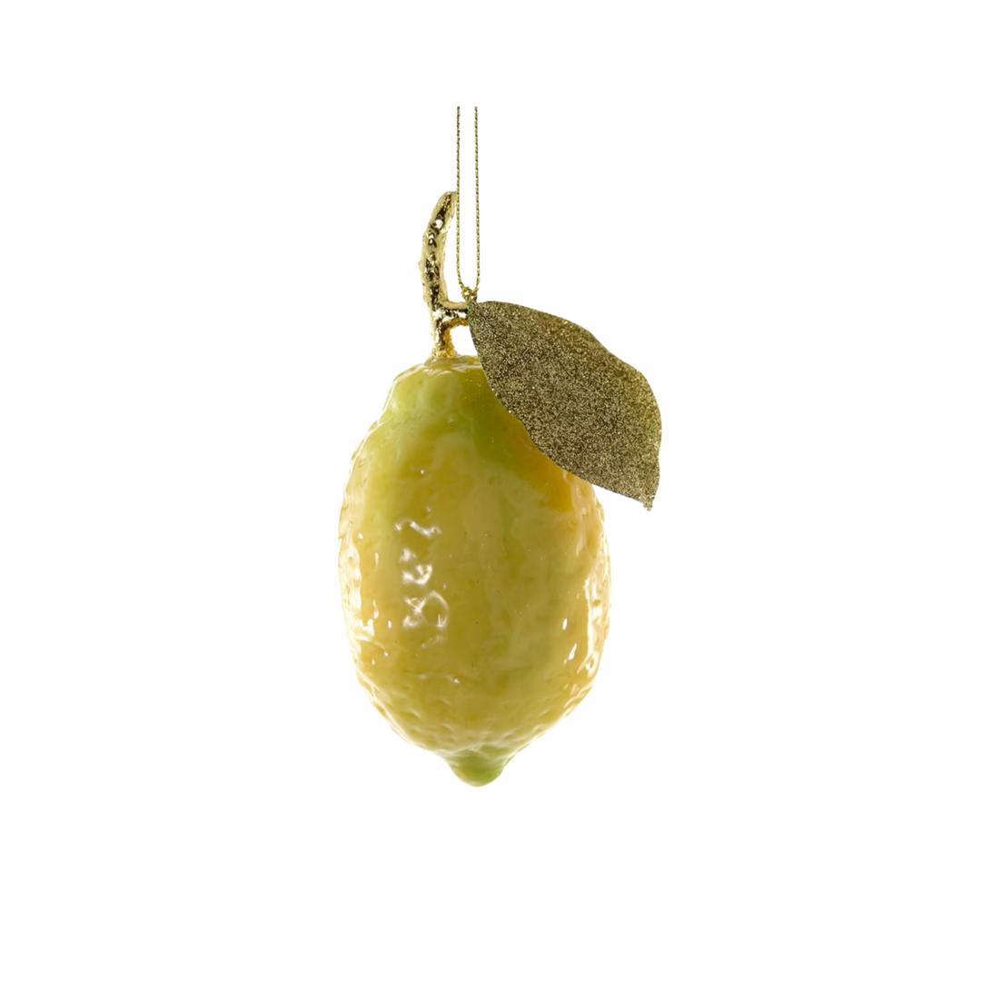 Cody Foster lemon Christmas ornament from Mood by DMJ, glossy glass lemon in soft yellow green with a single gilded leaf and a gold cord