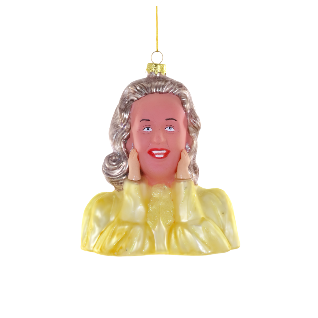 Cody Foster SNL Dooneese glass Christmas ornament with glittered blonde hair, yellow blouse, and hands on cheeks