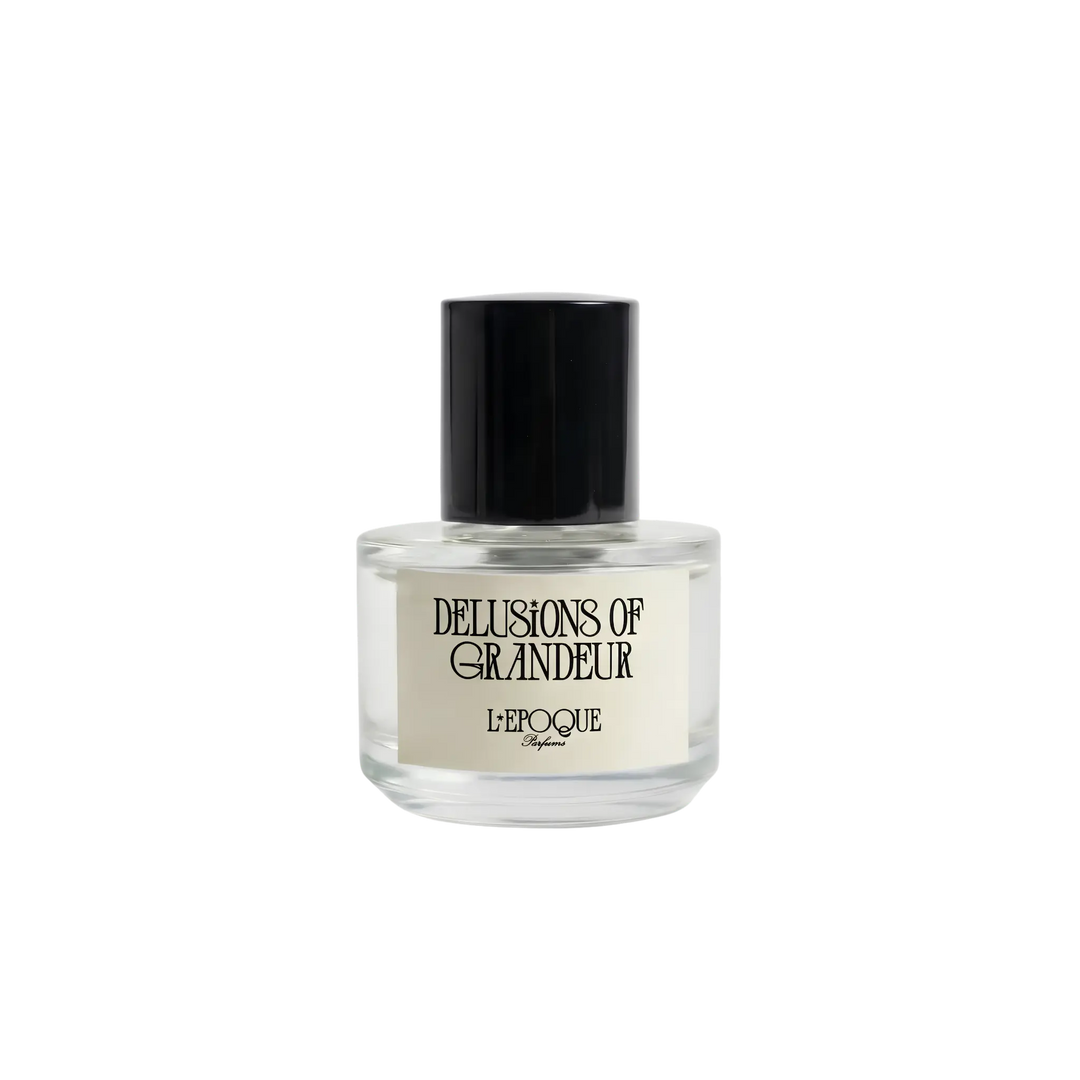 Clear glass bottle of Delusions of Grandeur Eau de Parfum by L&