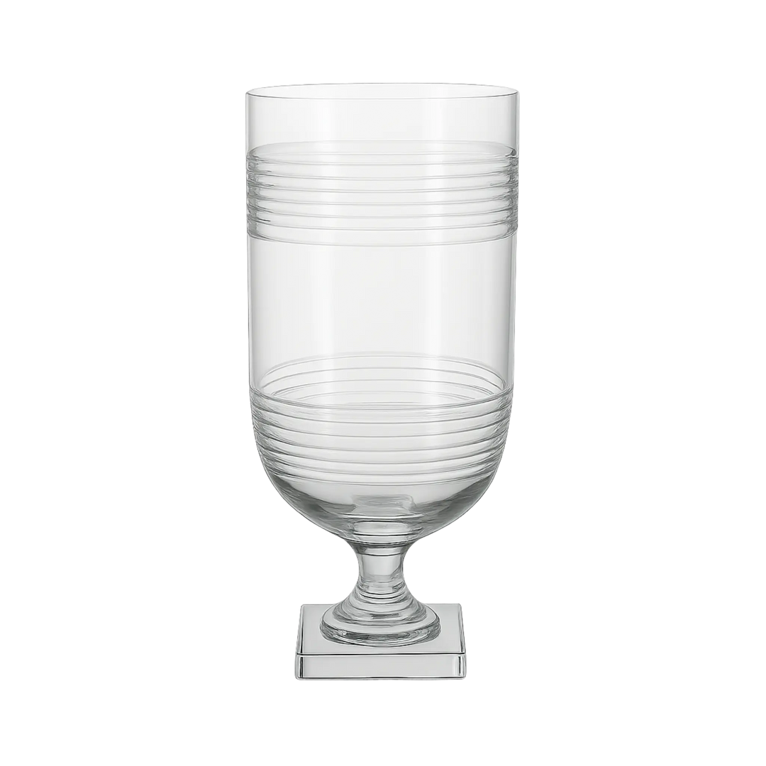 Tall etched striped glass hurricane with pedestal base styled for tabletop and mantel décor at Mood by DMJ in Lafayette, Louisiana