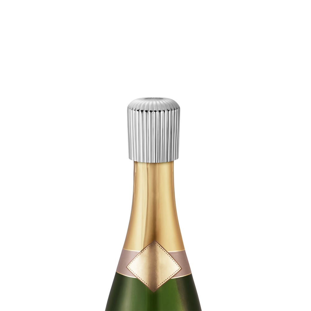 Georg Jensen Bernadotte stainless steel champagne stopper sealing an open bottle of champagne
