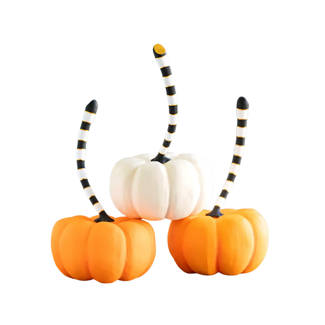 Glitterville Large Tabletop Pumpkins in dark orange, light orange, and white with black-and-white striped stems