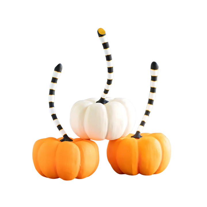 Glitterville Large Tabletop Pumpkins in dark orange, light orange, and white with black-and-white striped stems