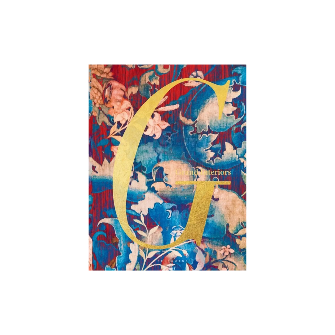 Grand Interiors by Geoffroy Van Hulle, Luster hardcover with a gold letter G over a blue and red floral pattern