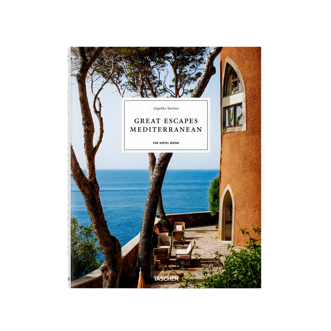 Great Escapes Mediterranean. The Hotel Book by Angelika Taschen, cover of a shaded seaside terrace beside a terracotta tower