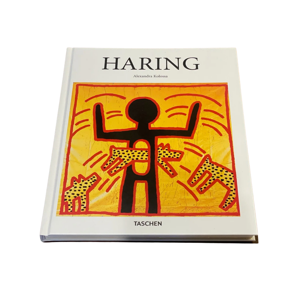 Front cover of Haring by Alexandra Kolossa from Taschen, a Keith Haring figure with dogs on yellow and orange