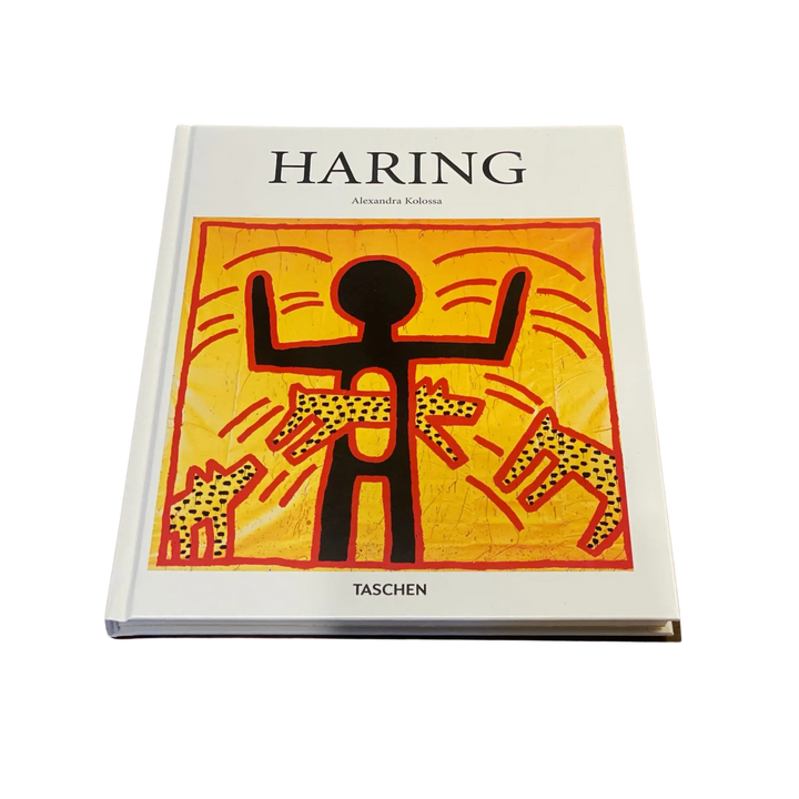Front cover of Haring by Alexandra Kolossa from Taschen, a Keith Haring figure with dogs on yellow and orange