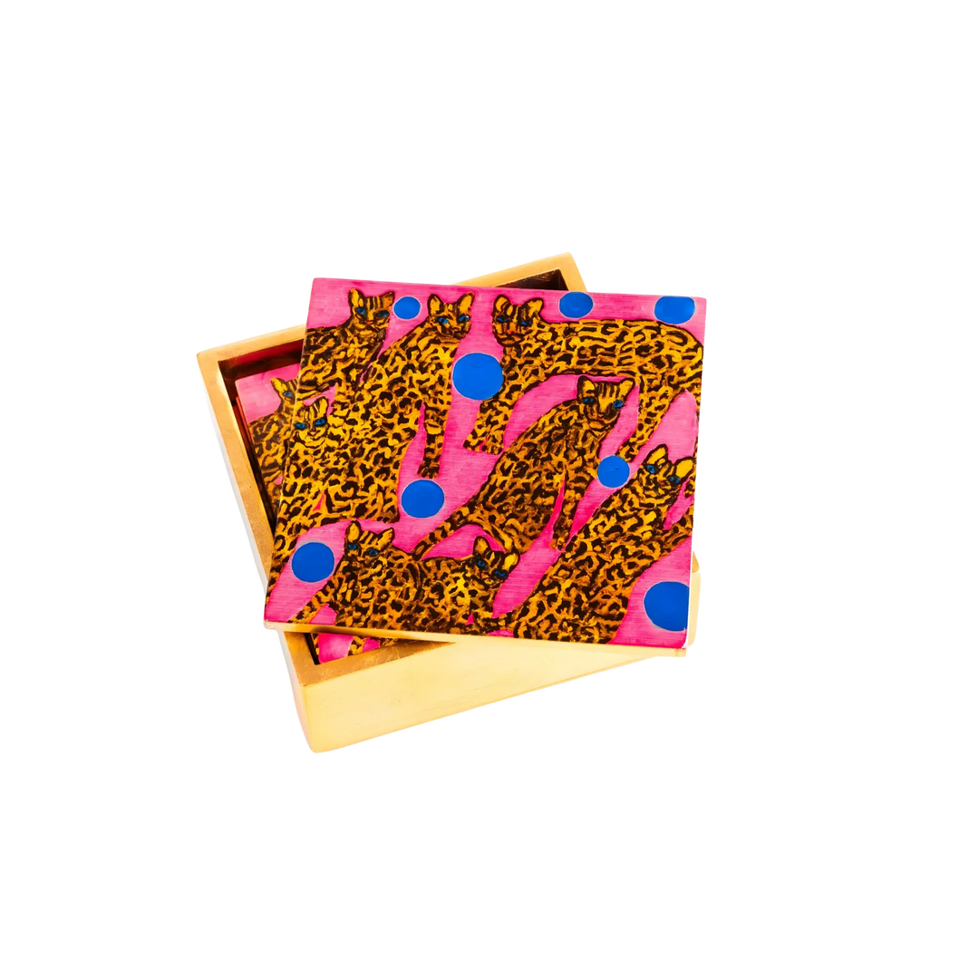 Hunt Slonem pink ocelot coasters in gold leaf box displayed as luxury home decor accessory