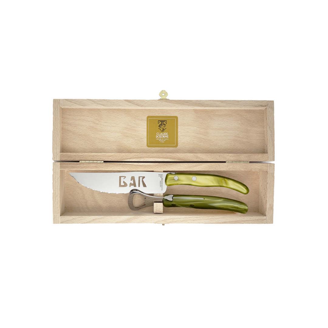 Laguiole Bar Set by Claude Dozorme with olive green handles — handcrafted French bar tool set including stainless steel bottle opener and serrated bar knife in a wooden gift box. Made in Thiers, France — luxury barware for cocktail enthusiasts.