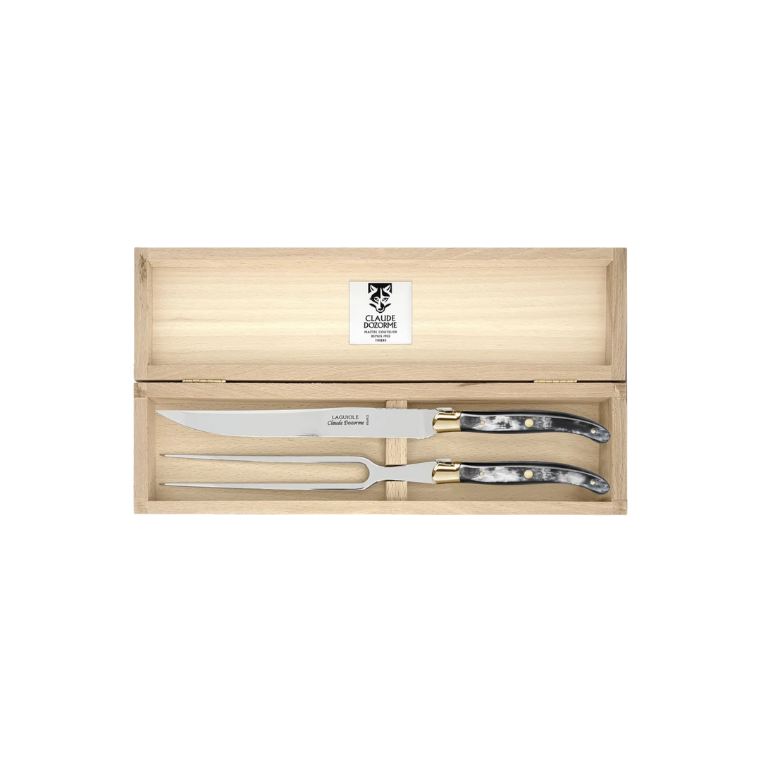 Laguiole Carving Set by Claude Dozorme with black horn handles — handcrafted 2-piece French carving knife and fork in a wooden gift box. Made in Thiers, France.