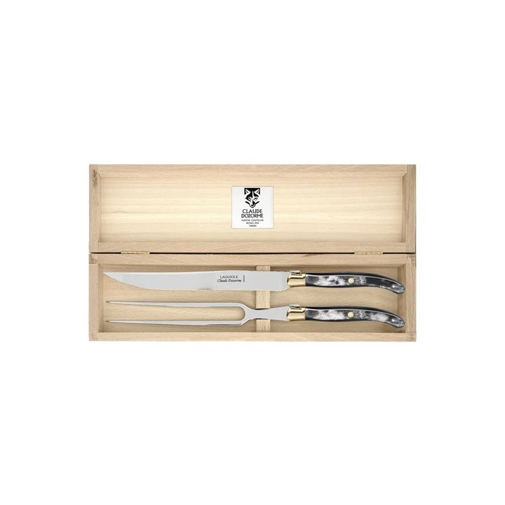 Laguiole Carving Set by Claude Dozorme with black horn handles — handcrafted 2-piece French carving knife and fork in a wooden gift box. Made in Thiers, France.