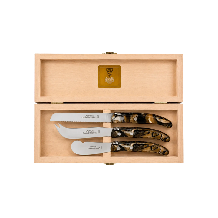 Laguiole Cheese Set by Claude Dozorme with smokey quartz handles — handcrafted 3-piece French cheese knife, slicer, and spreader in a wooden gift box. Made in Thiers, France — luxury cheese board accessories for entertaining and gifting.